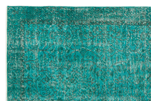 Load image 1 in gallery view. Teal and dark grey distressed rug with a traditional floral medallion pattern and a bordered edge.
