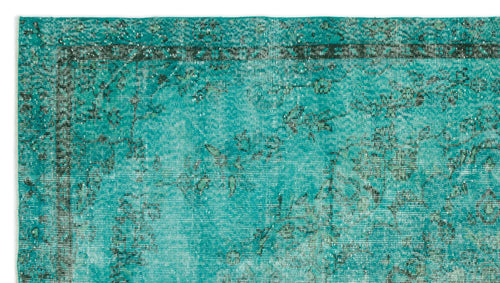 Load image 1 in gallery view. Teal and black distressed traditional rug with a faded floral border and central medallion pattern.