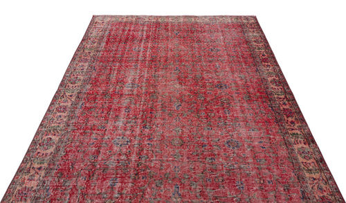 Load image 1 in gallery view. Distressed red vintage-style rug with a faded floral medallion pattern and intricate border on a white background.