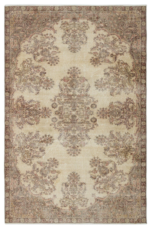 Load image 1 in gallery view. Beige and brown distressed traditional rug with a central floral medallion and ornate border.