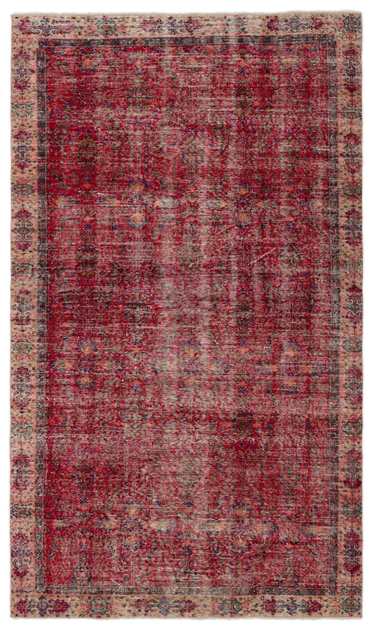 Distressed red and pink vintage-style rug with a faded central medallion and intricate floral border.