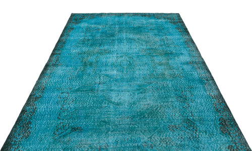 Load image 1 in gallery view. Distressed turquoise and black overdyed rug with a faded traditional medallion pattern on a white background.