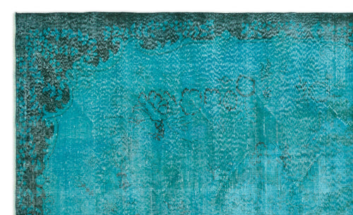 Load image 1 in gallery view. Teal and dark green distressed rug with a faded traditional floral medallion pattern.