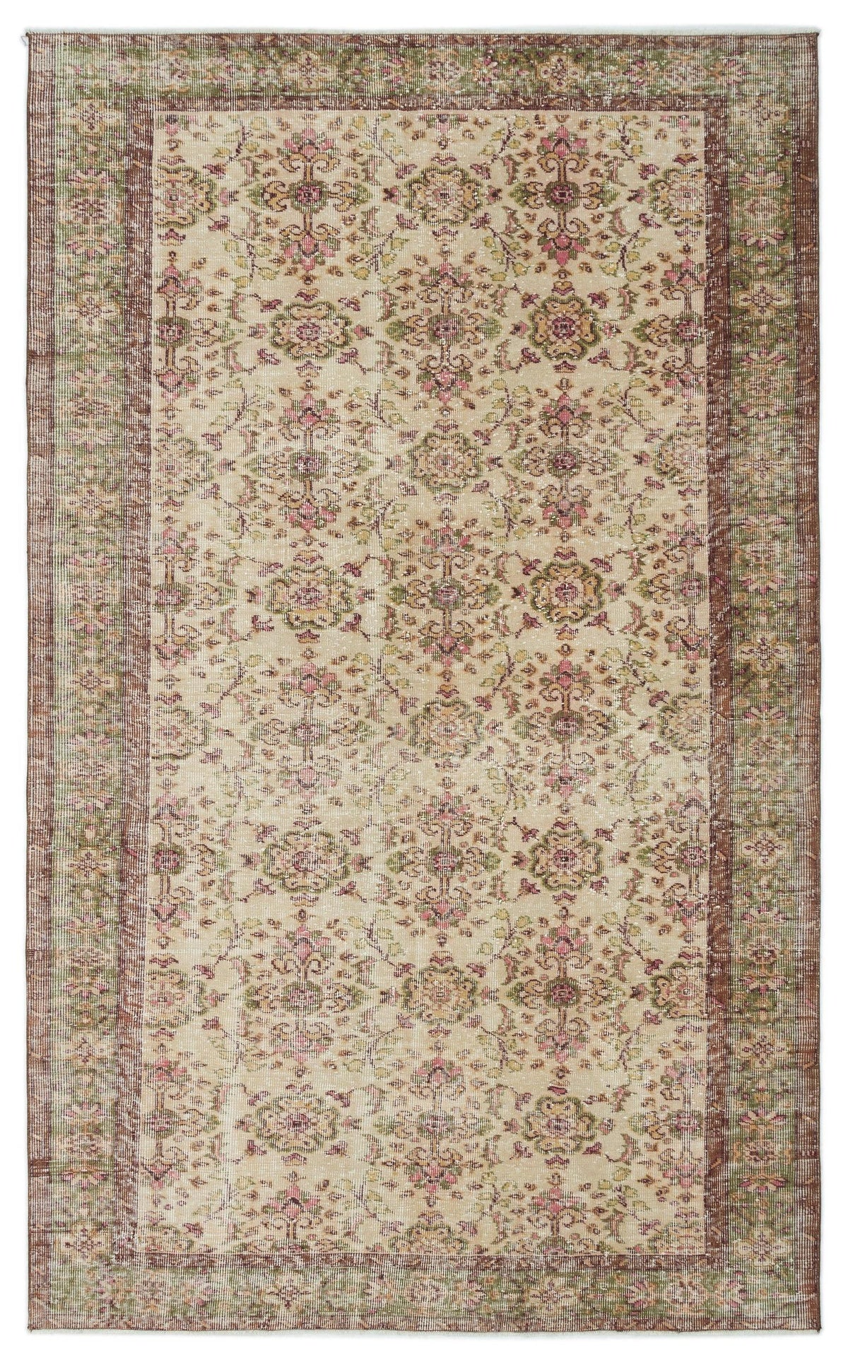 Beige vintage-style rug with a distressed floral medallion pattern in muted pink, green, and brown tones.