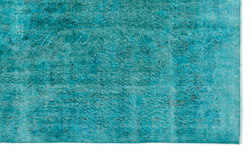 Load image 1 in gallery view. Teal rug with a distressed, overdyed vintage pattern and visible woven texture on a white background.