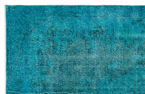 Load image 1 in gallery view. Teal distressed rug with a faded black floral medallion pattern on a white background.