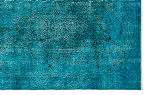 Load image 1 in gallery view. Teal distressed rug with a faded black traditional floral medallion pattern on a white background.