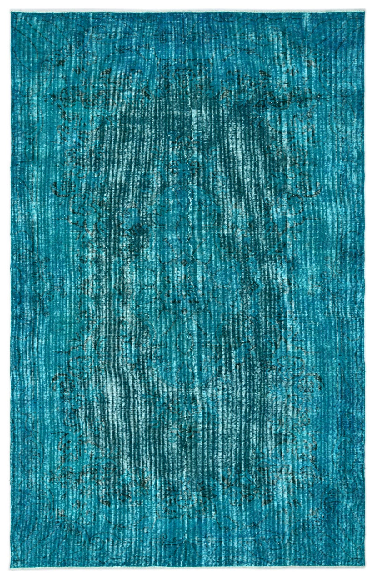 Teal distressed vintage-style rug with a faint, dark floral medallion pattern.