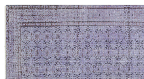 Load image 1 in gallery view. Lavender and dark brown vintage-style rug with a repeating floral medallion pattern and a decorative border.