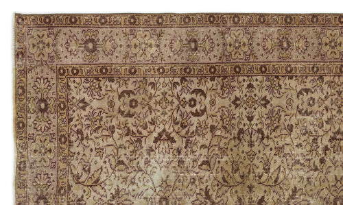 Load image 1 in gallery view. Distressed brown and beige vintage-style rug with an intricate floral medallion pattern and a wide decorative border.