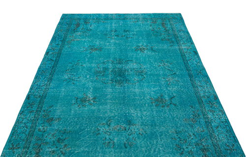 Load image 1 in gallery view. Teal distressed rug with a faded central medallion and ornate border pattern on a white background.