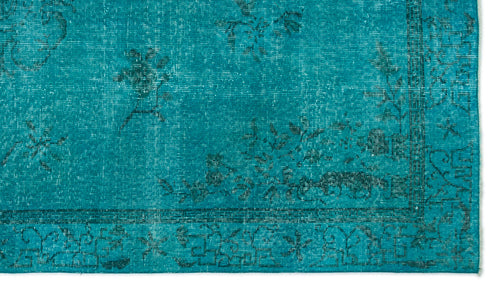 Load image 1 in gallery view. Teal distressed rug with a dark floral pattern and a geometric border.
