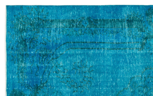 Load image 1 in gallery view. Bright turquoise rug with a distressed, faded traditional floral medallion pattern.