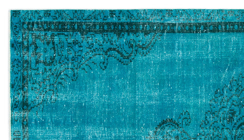 Load image 1 in gallery view. Teal and black distressed rug with a traditional ornate border and floral medallion pattern.