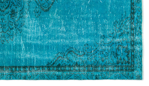 Load image 1 in gallery view. Bright turquoise distressed rug with a dark teal traditional floral border and faded medallion pattern.