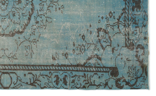 Load image 1 in gallery view. Distressed turquoise rug with a dark charcoal floral medallion pattern and a linear border.