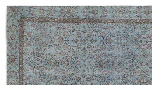 Load image 1 in gallery view. Light blue traditional rug with a distressed floral medallion pattern and a dark brown border.