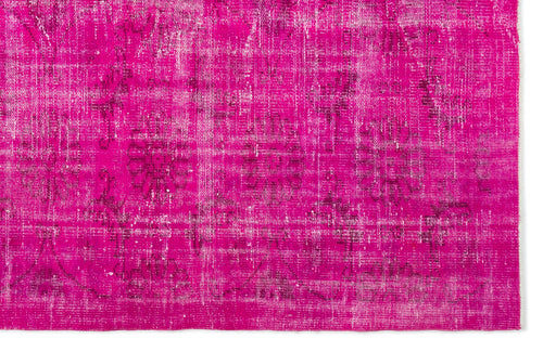 Load image 1 in gallery view. Vibrant magenta distressed rug with a faded traditional floral medallion pattern.