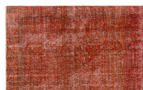 Load image 1 in gallery view. Rust-red vintage-style rug with a distressed, faded texture and subtle dark linear patterns.
