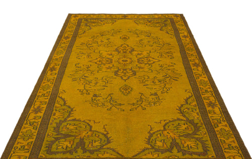 Load image 1 in gallery view. Mustard yellow and brown traditional rug with a central floral medallion and ornate border on a white background.