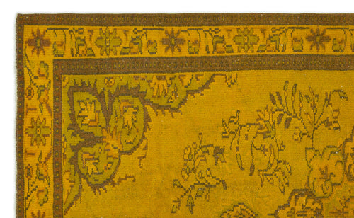 Load image 1 in gallery view. Mustard yellow rug with a brown floral border and traditional botanical motifs.