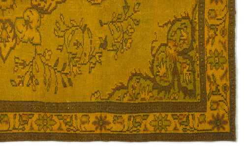 Load image 1 in gallery view. Mustard yellow rug with dark brown floral motifs and a geometric border pattern.