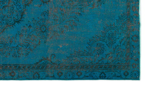 Load image 1 in gallery view. Teal rug with a dark charcoal distressed floral medallion pattern and a decorative border.