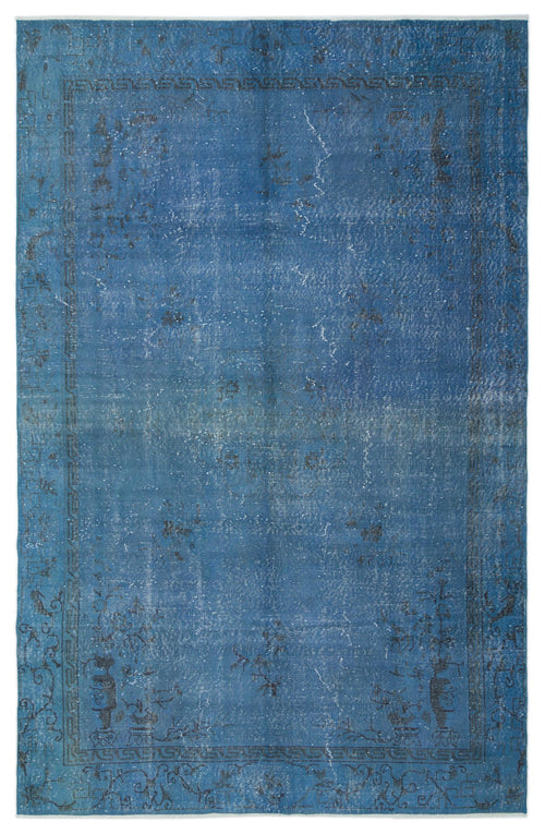 Load image 1 in gallery view. Distressed blue rug with a faded traditional border and central floral motif on a white background.