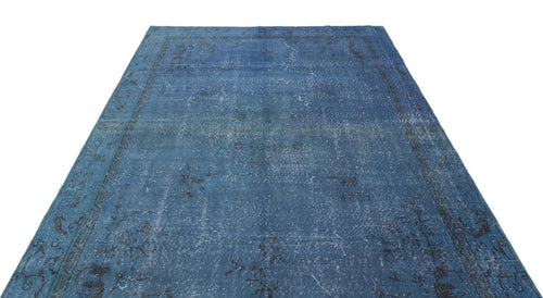 Load image 1 in gallery view. Blue distressed vintage-style rug with a faded traditional border and central medallion pattern.