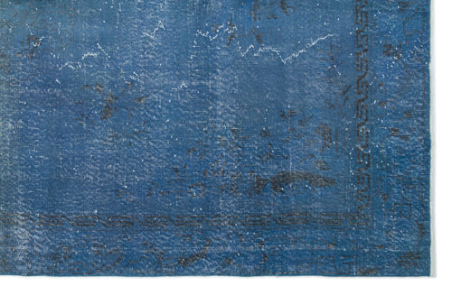 Load image 1 in gallery view. Distressed blue rug with a faded traditional pattern and a dark geometric border on a white background.