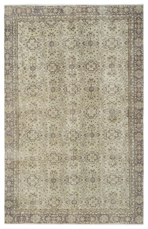 Load image 1 in gallery view. Beige and muted purple vintage-style rug with a distressed floral medallion pattern and a decorative border.