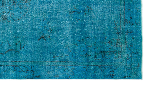 Load image 1 in gallery view. Bright turquoise distressed rug with a faded black linear border and sparse, worn-out traditional motifs.