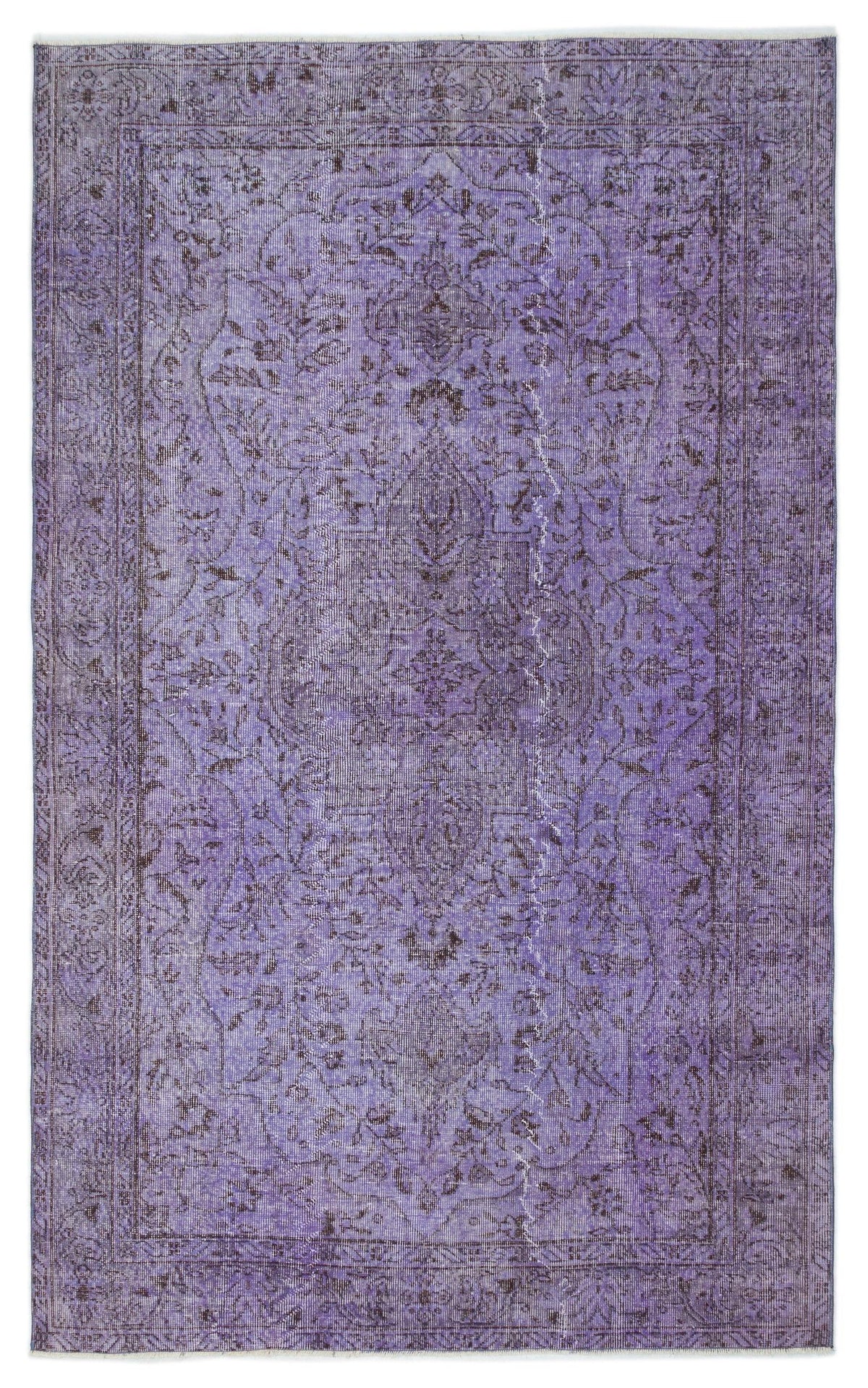 Distressed purple vintage-style rug with a dark floral medallion pattern and a detailed border.