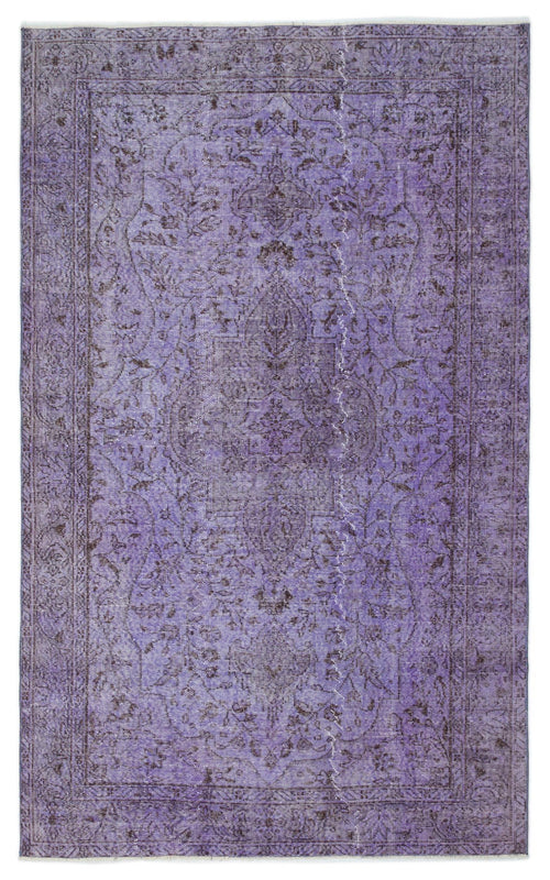 Load image 1 in gallery view. Distressed purple vintage-style rug with a dark floral medallion pattern and a detailed border.