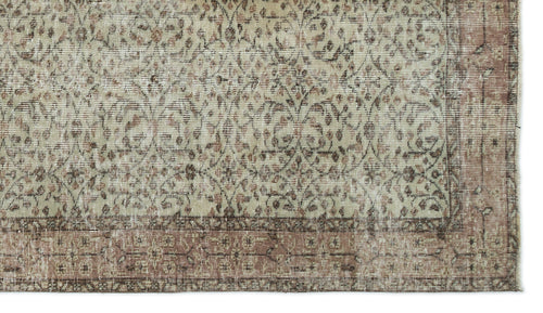 Load image 1 in gallery view. Beige and muted rose vintage-style rug with a distressed floral vine pattern and a wide decorative border.