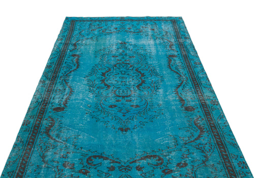 Load image 1 in gallery view. Bright turquoise distressed rug with a dark charcoal traditional medallion pattern on a white background.