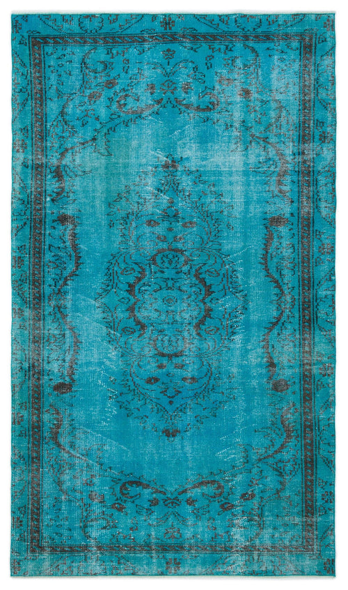 Load image 1 in gallery view. Bright turquoise distressed rug with a dark charcoal central floral medallion and ornate border pattern.