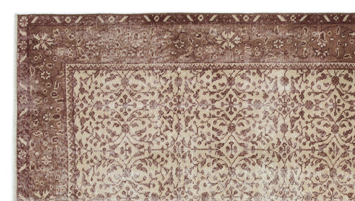 Load image 1 in gallery view. Brown and beige rug with a distressed traditional floral medallion pattern and a wide decorative border.