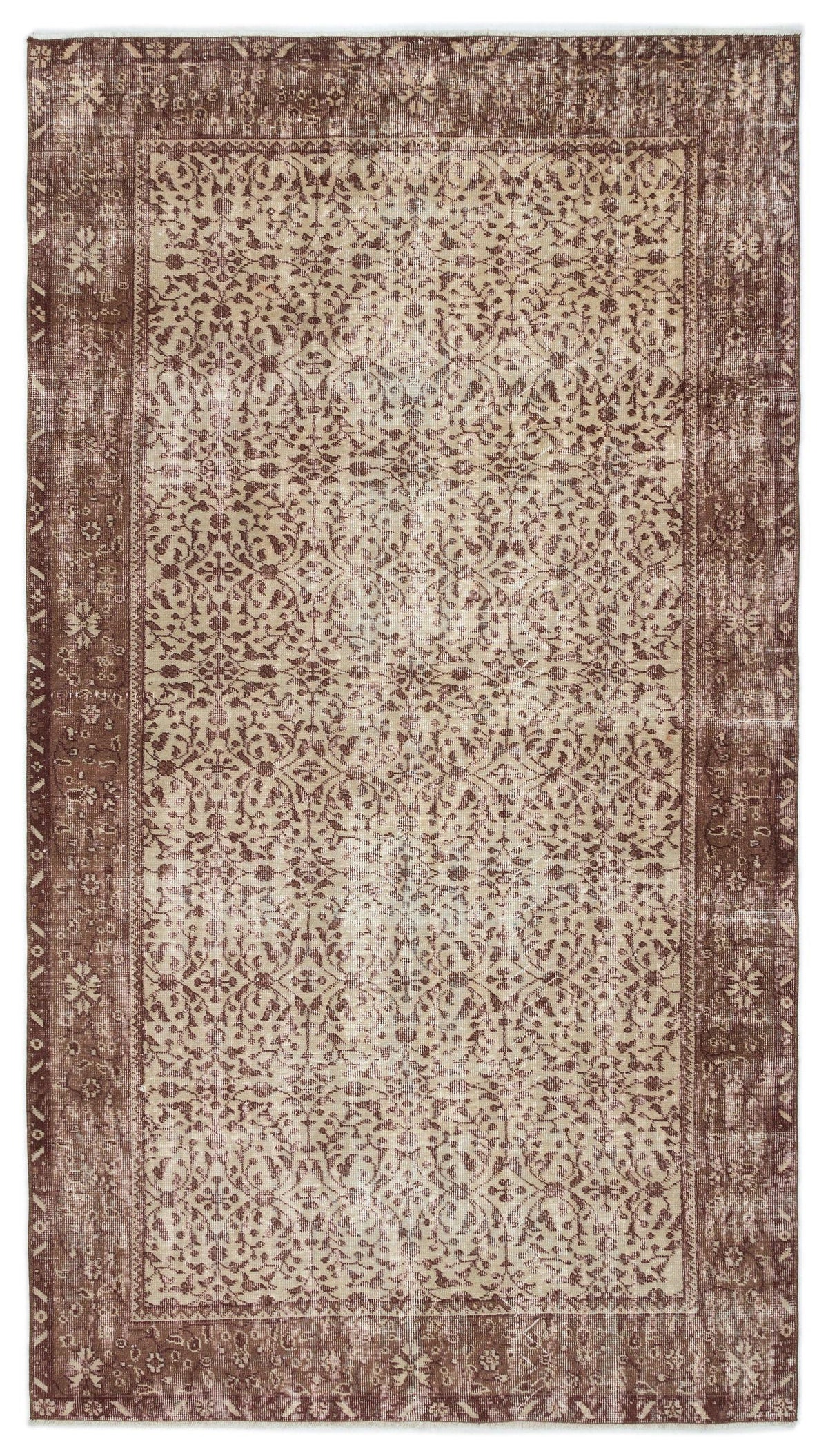 Brown and beige vintage-style rug with a distressed floral vine pattern and a wide decorative border.