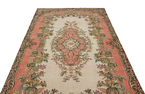 Load image 1 in gallery view. Beige, coral, and green traditional rug with a central floral medallion and ornate border on a white background.