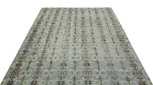 Load image 1 in gallery view. Light blue area rug with a repeating dark grey diamond lattice pattern and muted floral accents.