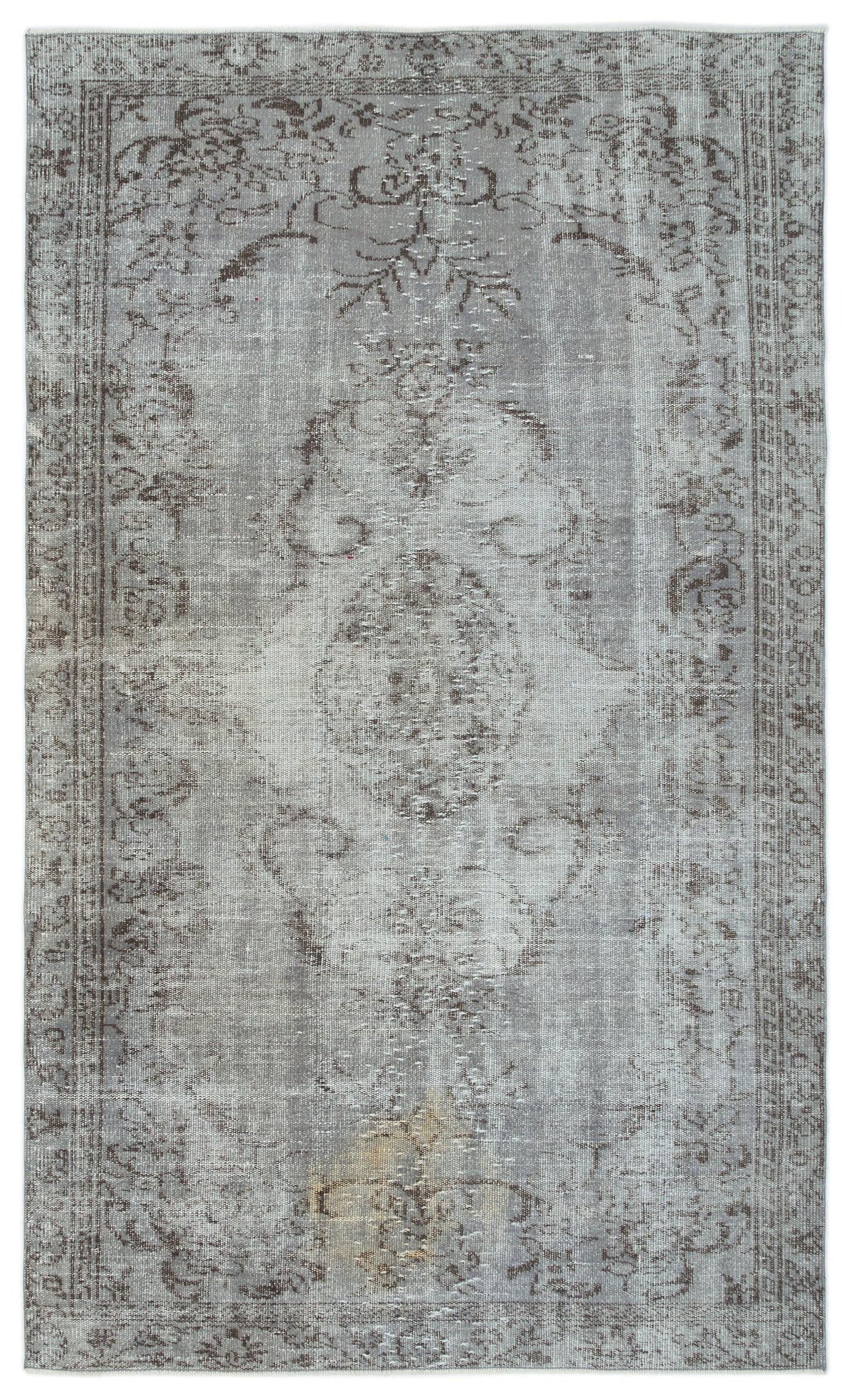 Grey and taupe distressed traditional rug with a central medallion and ornate border pattern.