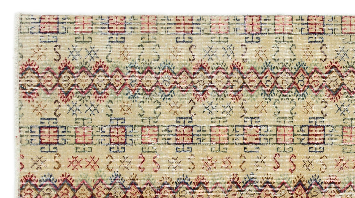 Beige rug with horizontal bands of red and blue geometric grid patterns, diamond motifs, and small tribal symbols.