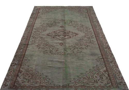 Load image 1 in gallery view. Distressed grey and brown vintage-style rug with a central medallion and ornate border pattern on a white background.