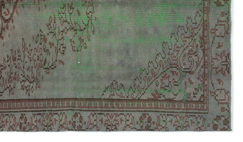 Load image 1 in gallery view. Distressed grey and brown rug with a traditional floral medallion border and overdyed green accents.