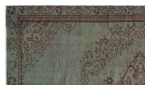 Load image 1 in gallery view. Distressed grey rug with a faded brown floral border and corner medallion pattern.