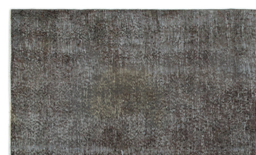 Load image 1 in gallery view. Dark charcoal and grey distressed vintage-style rug with a faded, low-pile texture.