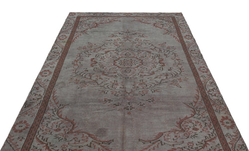 Load image 1 in gallery view. Distressed grey and terracotta rug with a central floral medallion and ornate border pattern on a white background.