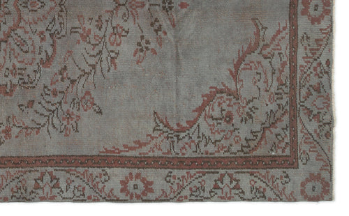 Load image 1 in gallery view. Grey and terracotta vintage-style rug with a distressed floral medallion pattern and a detailed border.