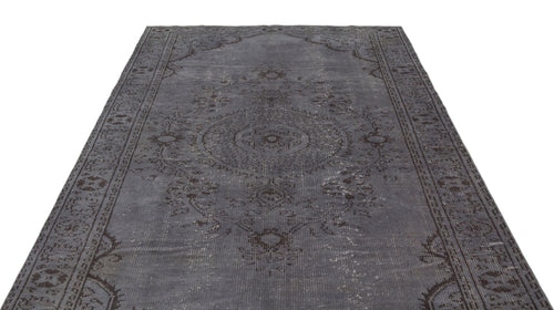 Load image 1 in gallery view. Charcoal grey distressed rug with a traditional central medallion and ornate border pattern on a white background.